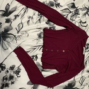 Long sleeved crop top button up shirt.